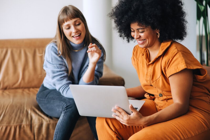 Two women discussing PEX's crawl, walk, run approach for adopting Ai in finance