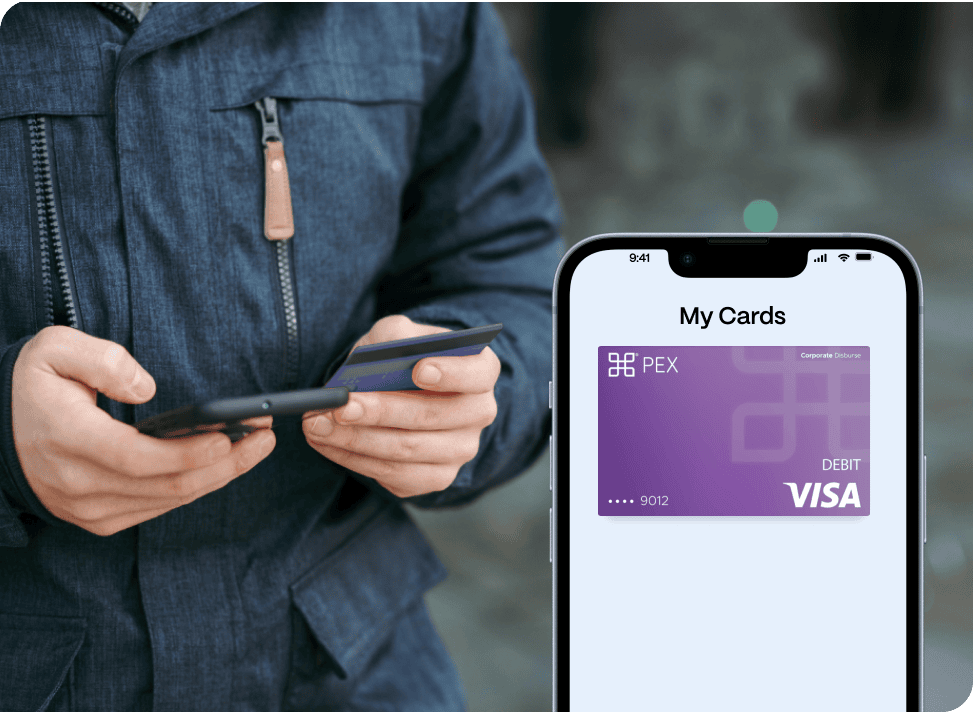 EDITED - Disburse Wallet Image Person holding a phone while removing a card from a wallet. A smartphone nearby displays a digital representation of a PEX corporate Visa debit card.