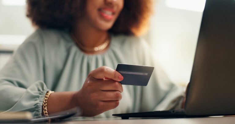 A person holding a corporate card for corporate card reconciliation purposes.