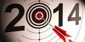 The number 2014 with a dart hitting the bullseye of a target symbol, emphasizing precision or achievement.