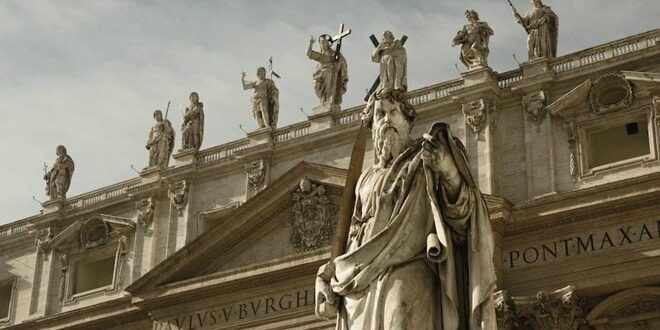 Statues adorn the facade of St. Peter's Basilica, with a prominent foreground statue. Ornate architecture is highlighted against a cloudy sky.