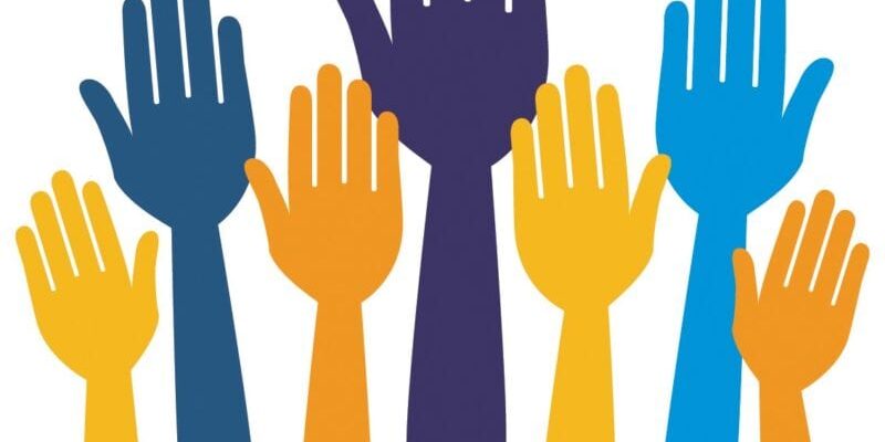 Illustration of raised hands in various colors, including blue, purple, and yellow, against a white background.