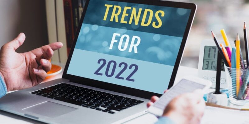 Trends for 2022 or business  creativity with text and young person using conputer.planning and strategy.