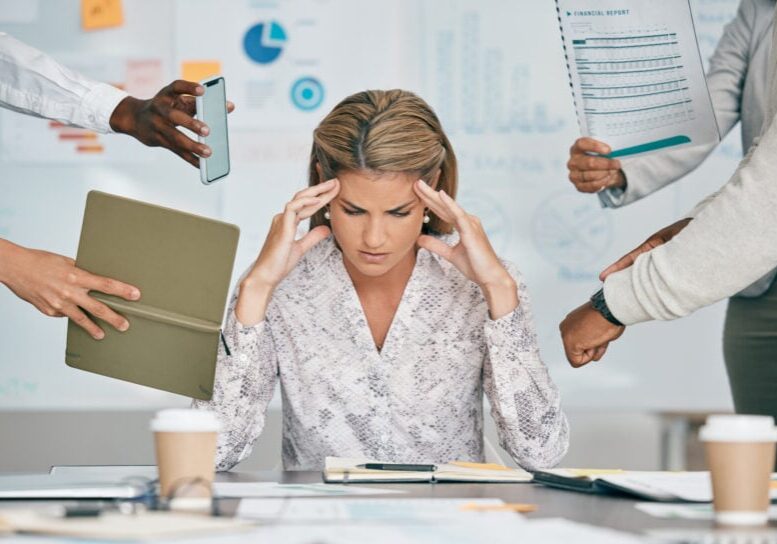 Woman, headache and office with stress, multitasking deadline or tired of project management target. Corporate executive, documents or email on schedule, anxiety and burnout of mental health by desk