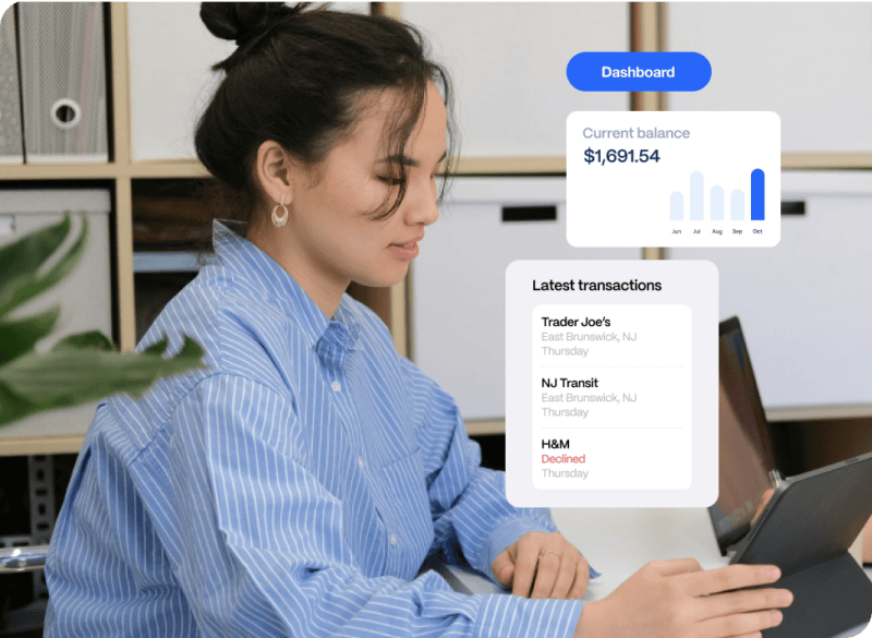 beneficiary-disburse A person in a striped shirt looks at a tablet displaying a dashboard with a balance of $1,691.54 and recent transactions, including declined activity.