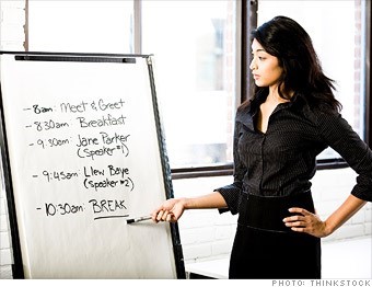event-job.jpg A woman points to a schedule on a flip chart listing times and events from 8:00 a.m. to a 10:30 a.m. break.