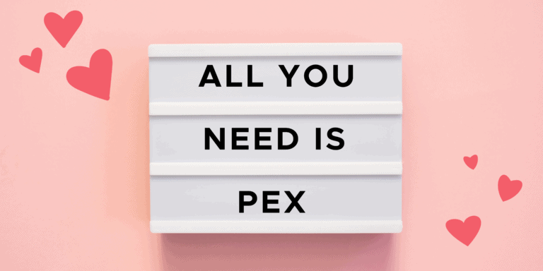 A lightbox sign reading "ALL YOU NEED IS PEX" on a pink background with red and pink heart decorations.